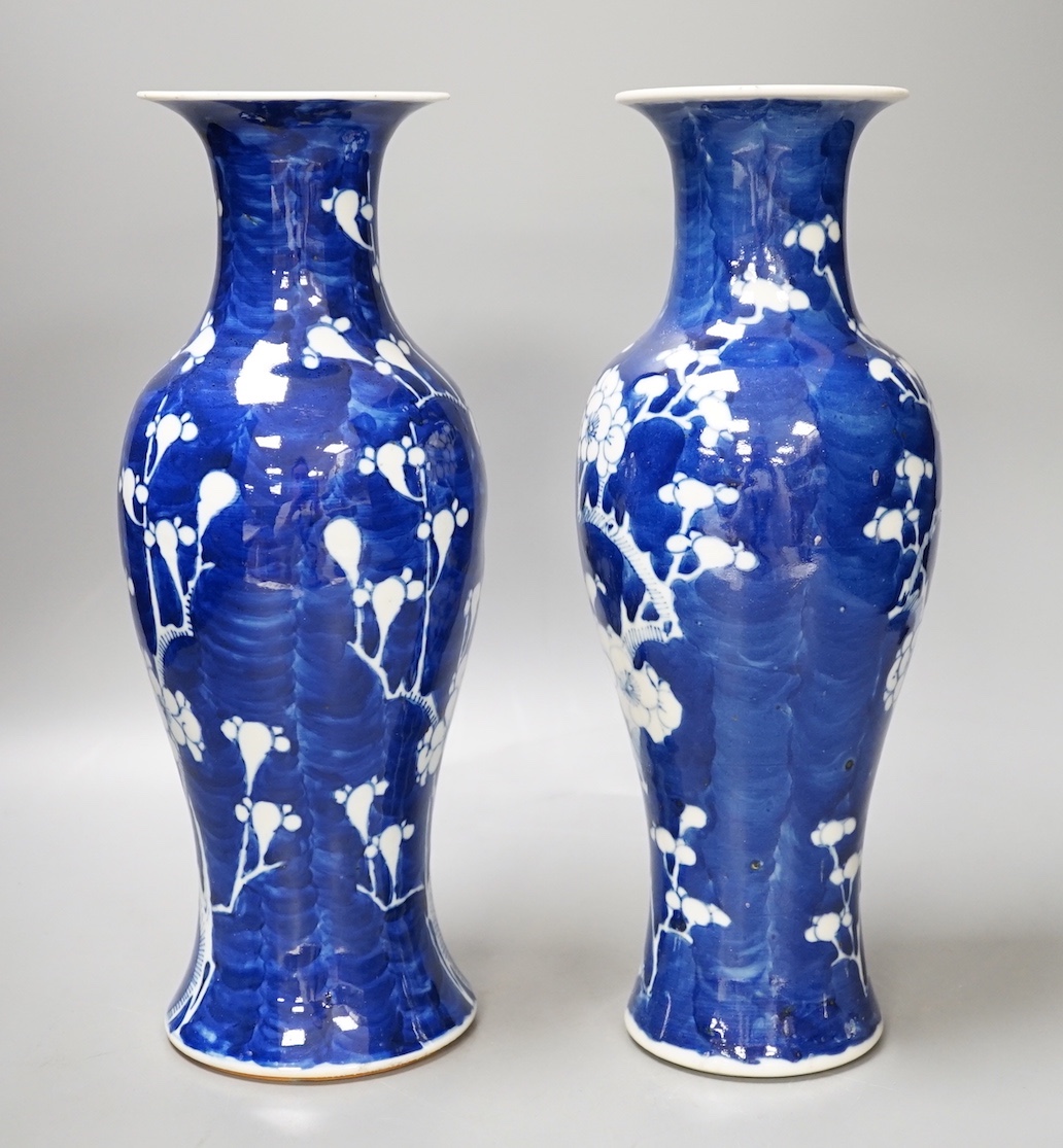 Two 19th century Chinese blue and white prunus vases, 31cm
